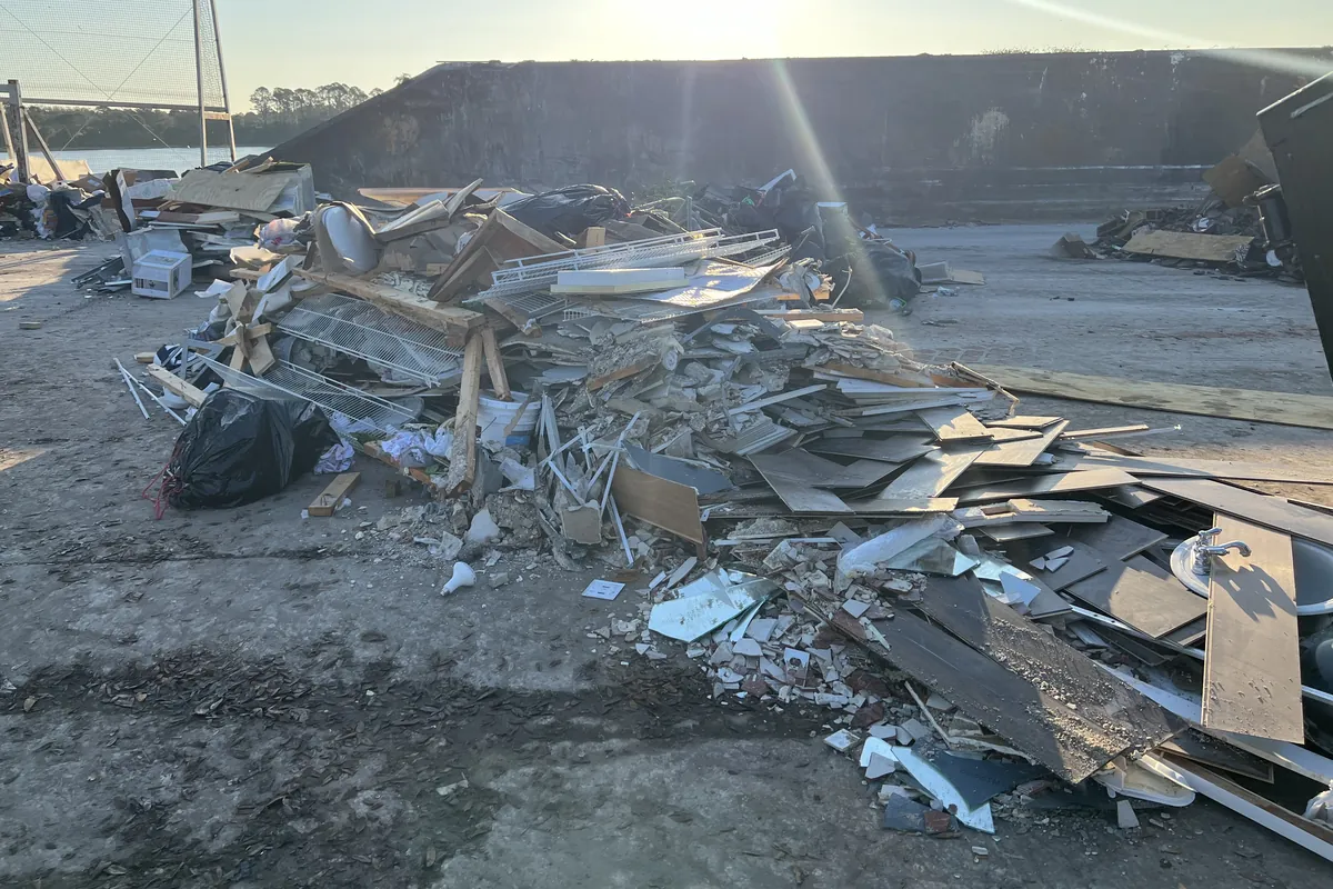 Pile of drywall, lumber and scrap metal from a renovation, tipped at the disposal yard